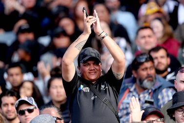 A New Zealand fan celebrates a try against Australia during the second Bledisloe Cup rugby union match between New Zealand and Australia in Auckland on October 18, 2020. / AFP / MICHAEL BRADLEY