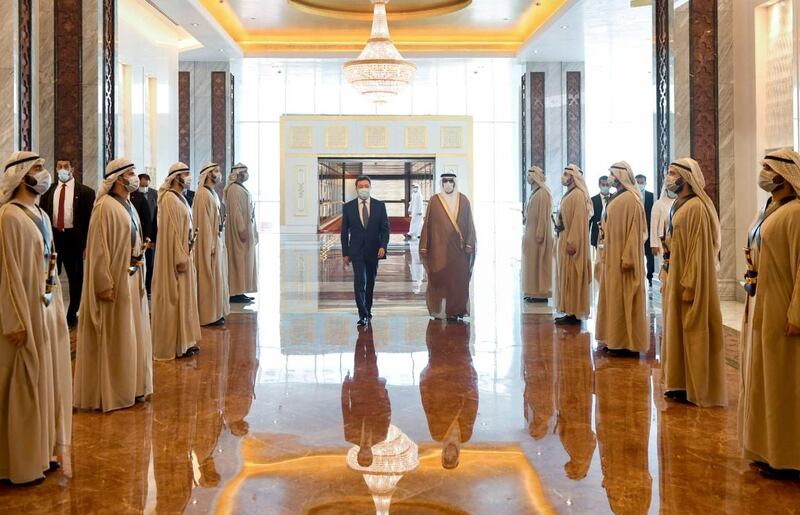 Prime Minister of Kazakhstan Askar Mamin is welcomed by Mohammed Al Bowardi, Minister of State for Defence Affairs, on arrival at the Presidential Flight airport in Abu Dhabi on Sunday. Wam