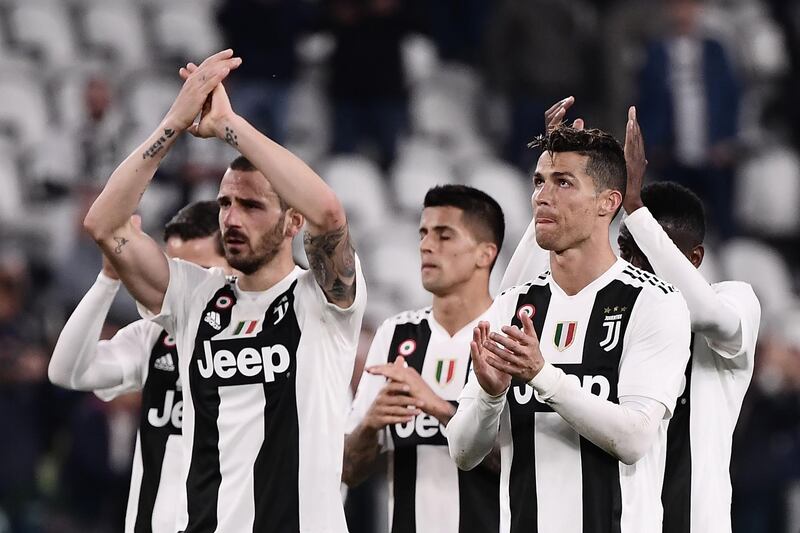 Juventus players applaud their supporters at the end of the match. AFP