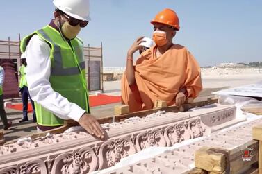 Pavan Kapoor, Indian ambassador to the UAE, with Swami Brahmavihari from Baps Swaminarayan Sanstha, with the stone carvings that are at the site in Abu Dhabi. The Baps Swaminarayan Sanstha is overseeing the construction. Courtesy: Baps Swaminarayan Sanstha
