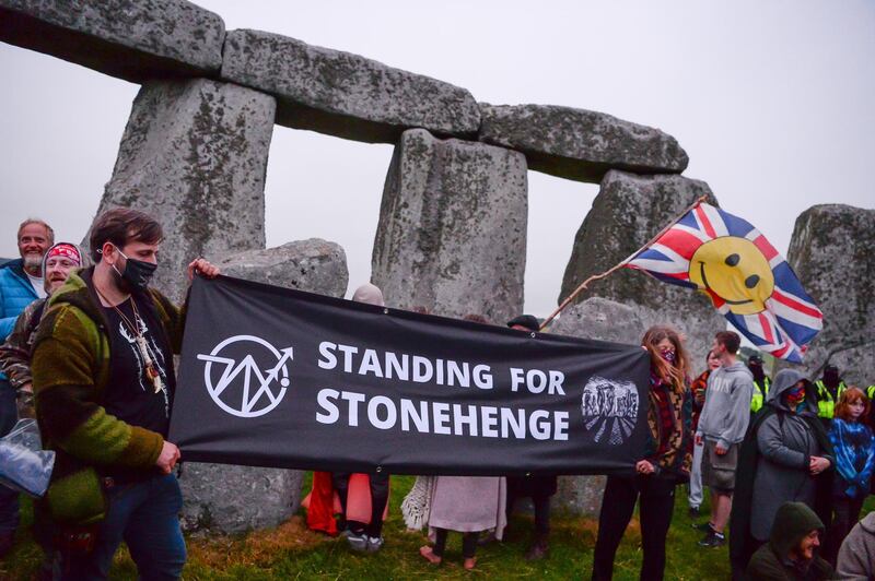 A 'Standing For Stonehenge' banner is displayed after a large number of people enter the closed site of Stonehenge. Getty Images