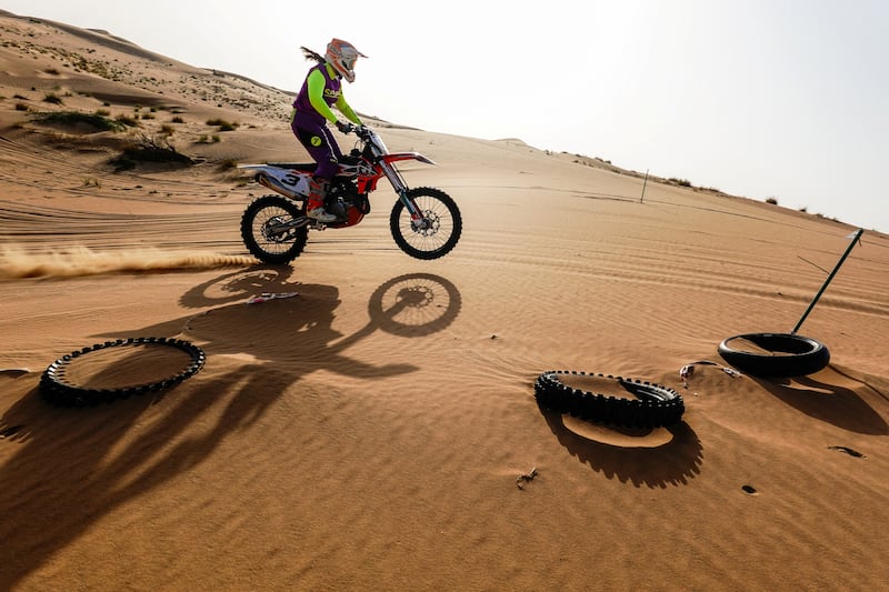 Elisha Dessurne hits the throttle in the Dubai desert.