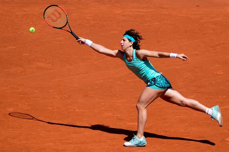 Carla Suarez Navarro returns the ball to Caroline Garcia during their WTA Madrid Open quarter-final at the Caja Magica in Madrid. Javier Soriano / AFP