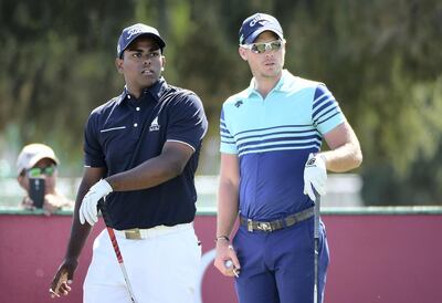 DUBAI, UNITED ARAB EMIRATES - FEBRUARY 05:  Amateur Rayhan Thomas of India (L) of India looks on with Danny Willett of England during the final round of the Omega Dubai Desert Classic at Emirates Golf Club on February 5, 2017 in Dubai, United Arab Emirates.  (Photo by Ross Kinnaird/Getty Images)