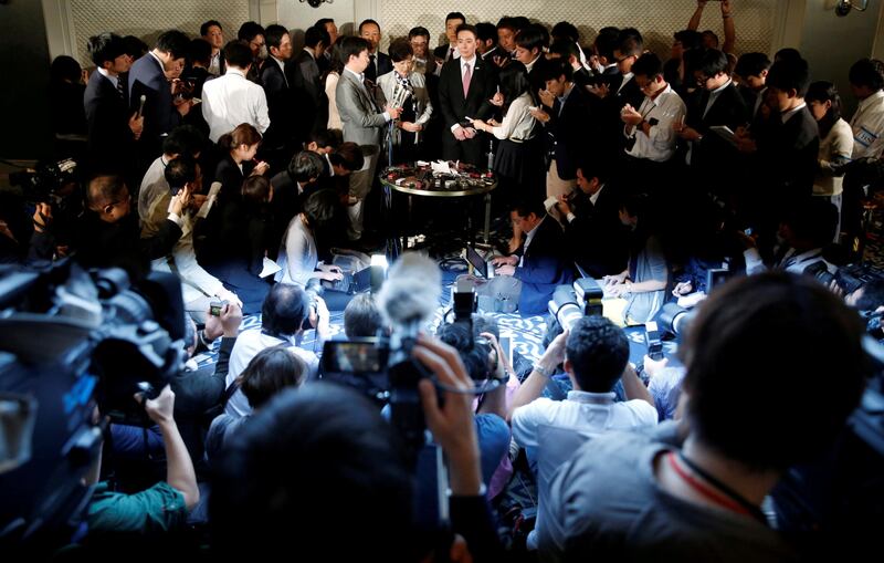 Tokyo Governor Yuriko Koike and Democratic Party leader Seiji Maehara at a press conference in the Japanese capital. Issei Kato / Reuters