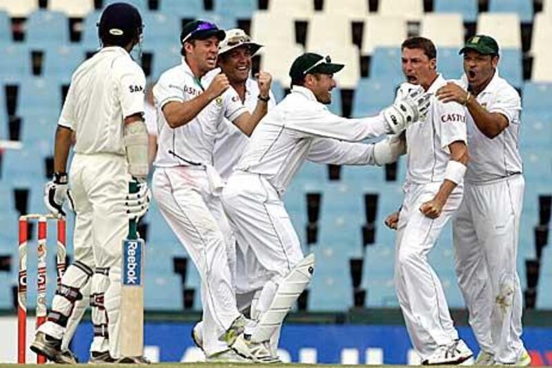 South Africa's Dale Steyn, second from right, celebrates with teammates after dismissing India's Gautam Gambhir.