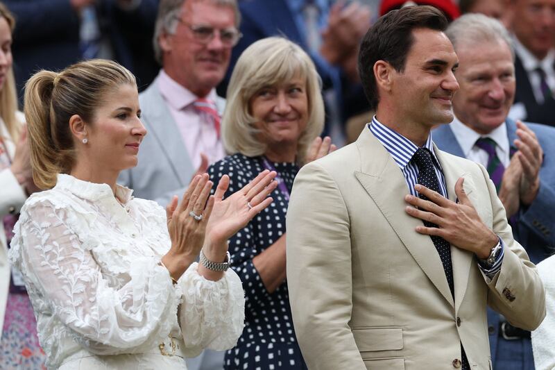 Roger Federer acknowledges the crowd as he is given a tribute. AFP