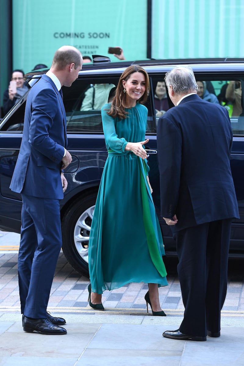 Britain's Prince William, Duke of Cambridge and Britain's Catherine, Duchess of Cambridge are greeted by Prince Shah Karim Al Hussaini, Aga Khan IV on arrival for a visit to the Aga Khan Centre in London on Wednesday, October 2, 2019. AFP