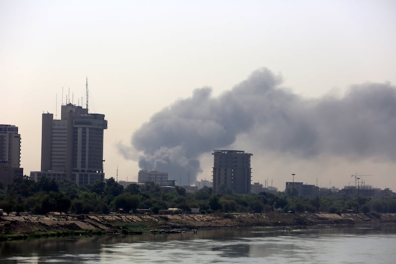 Smoke rises from a building in Baghdad. EPA