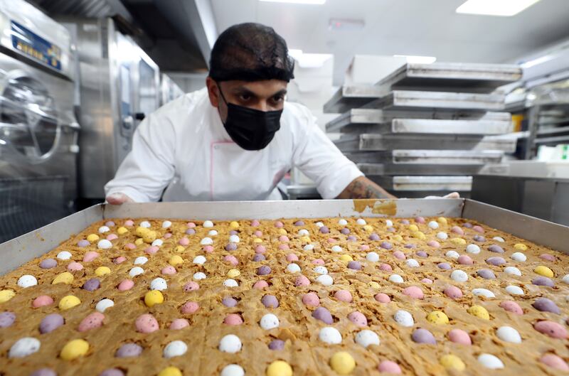 Head chef Ajandha inspects the Egg Explosion Blondies. SugarMoo, in Al Quoz, Dubai, creates cakes and other desserts during a busy weekend, in which Easter coincides with Ramadan. All photos: Chris Whiteoak / The National