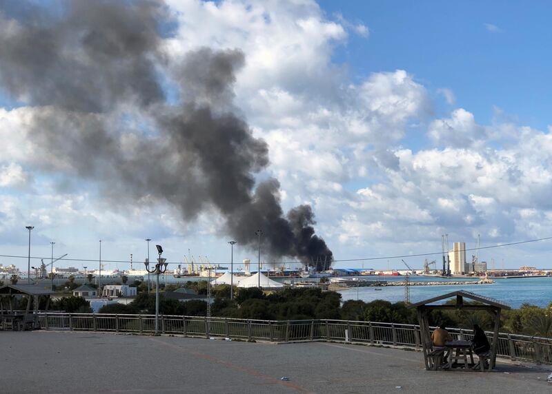 Smoke rises from a port in Tripoli, Libya after being attacked. REUTERS