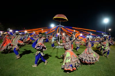 Indians in traditional dress perform the garba, the traditional dance of Gujarat state, during Navratri festival celebrations in Ahmedabad, India, September 27, 2022.  AP