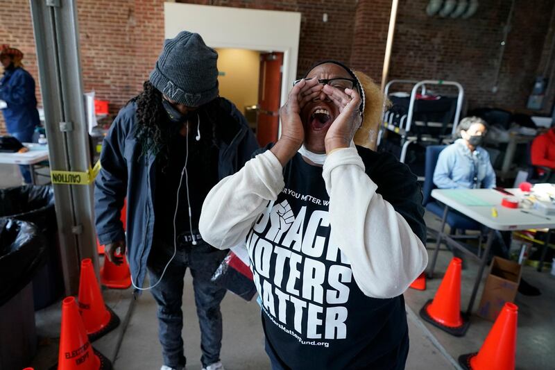 Denise Pumphrey shouts "first-time voter" at the Kentucky Center for African American Heritage in Louisville. AP Photo