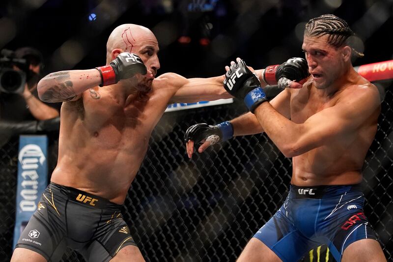 Alexander Volkanovski, left, throws a punch against Brian Ortega. AP Photo