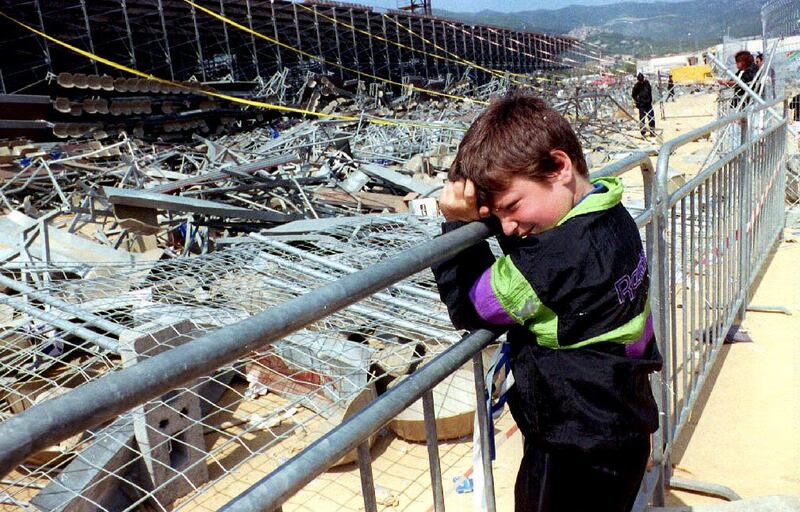 A child grieves at the site the day after a temporary stand collapsed at the Armand-Cesari stadium in Furiani near Bastia, France on May 5, 1992, causing 19 dead and over 2,000 injured. AFP