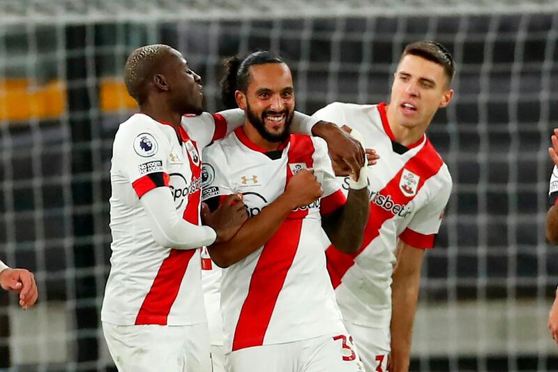 Theo Walcott (C) celebrates with teammates after scoring the opening goal for Southampton in the Premier League match against Wolverhampton Wanderers at the Molineux Stadium. AFP