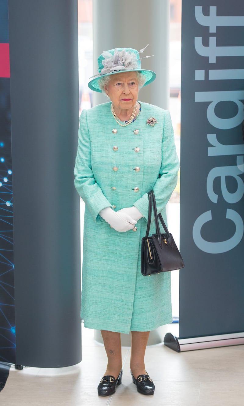 Queen Elizabeth II, wearing green, opens the Cardiff University Brain Research Imaging Centre on June 7, 2016. Getty Images