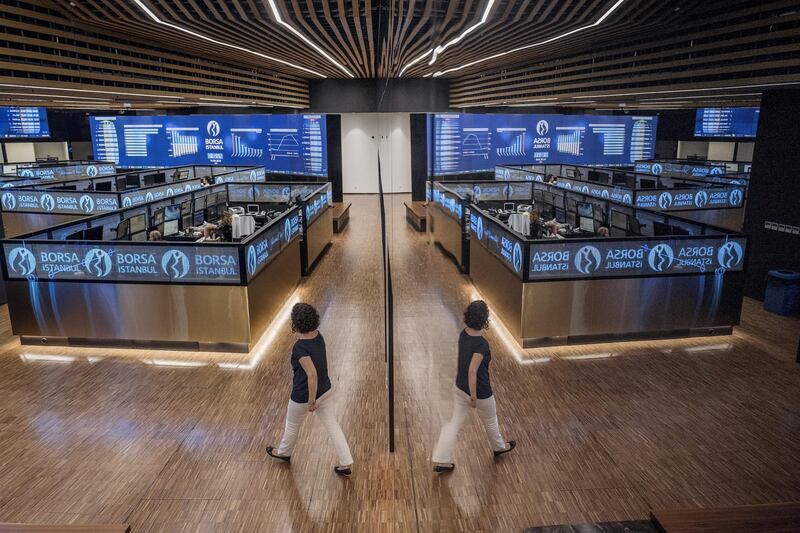 A visitor is reflected while crossing the trading floor at the Borsa Istanbul SA stock exchange in Istanbul, Turkey, on Tuesday, Aug. 14, 2018. While they are growing more critical, the underlying tone of warnings from businesses has so far been supportive of the government in principle, showing there are limits to how much Turkey’s billionaires are feeling emboldened to speak out after elections in June increased President Recep Tayyip Erdogan’s grip on power. Photographer: Ismail Ferdous/Bloomberg