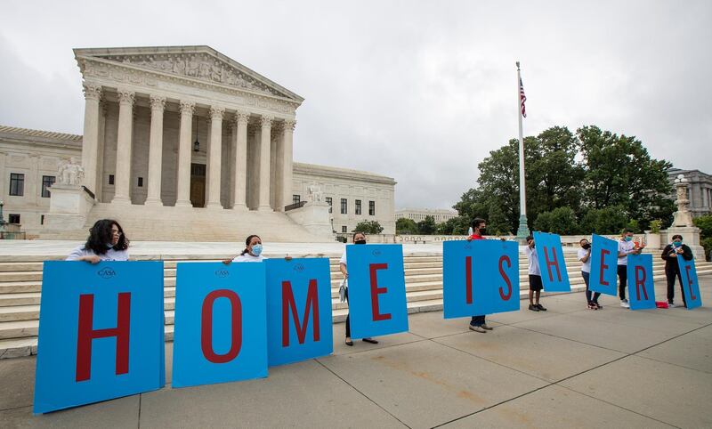 FILE - In this June 18, 2020, file photo, Deferred Action for Childhood Arrivals (DACA) students gather in front of the Supreme Court in Washington. Immigration judges say they are being muzzled by the Trump administration and the union that represents them is suing the U.S. Department of Justice. The lawsuit filed Wednesday, July 1, 2020, is the latest confrontation between the judges and the Justice Department, which oversees U.S. immigration courts. (AP Photo/Manuel Balce Ceneta, File)