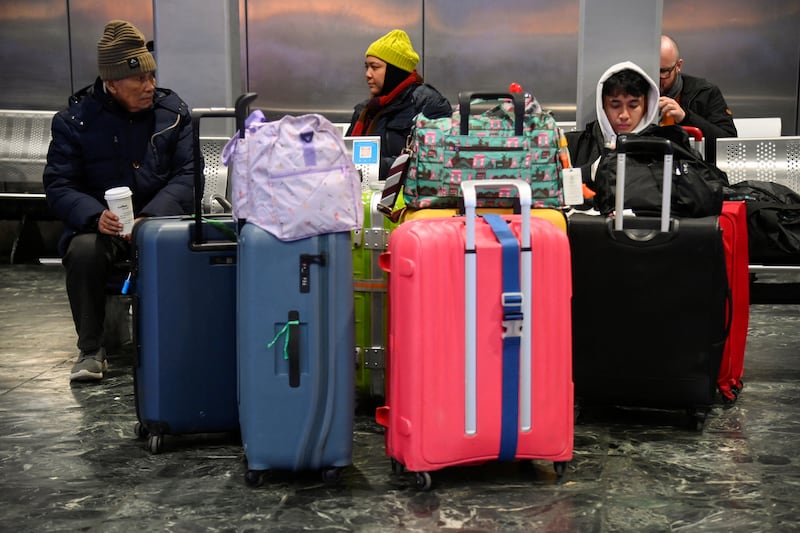 Passengers wait at the concourse of Euston in London. Reuters