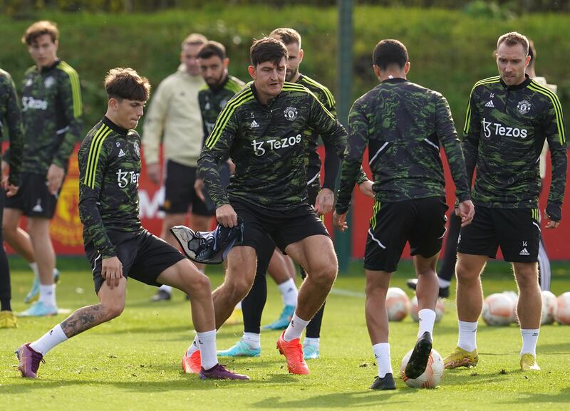 Harry Maguire, centre, and Christian Eriksen with Manchester United teammates during training in Carrington. PA