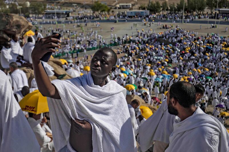 A Muslim pilgrim takes a 'selfie' picture atop Mount Arafat, also known as Jabal al-Rahma (Mount of Mercy), southeast of the holy city of Mecca, during the climax of the Hajj pilgrimage. AFP