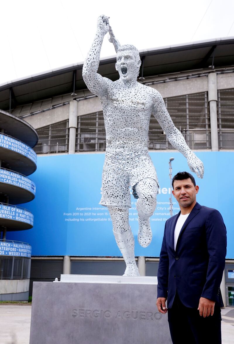 Manchester City club legend Sergio Aguero attends the unveiling of his statue outside the Etihad Stadium, to commemorate the 10th anniversary of the club's first Premier League title and the iconic '93:20' moment in Manchester, England, Friday May 13, 2022. AP