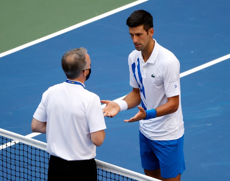 Novak Djokovic  talks to the head of officiating at the International Tennis Federation Soeren Friemel. EPA