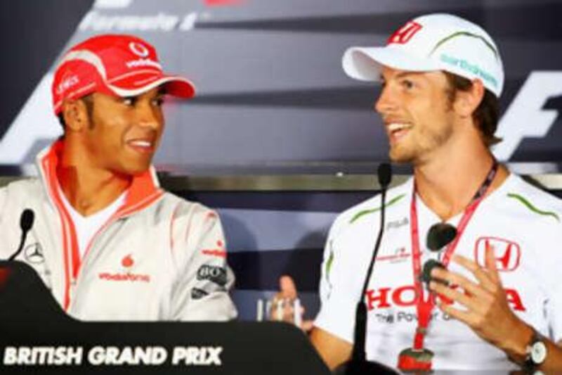 Lewis Hamilton and Jenson Button of share a joke.