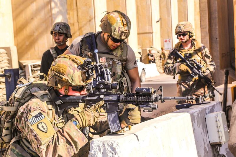 US soldiers man a defensive position at Forward Operating Base Union III in Baghdad. Reuters