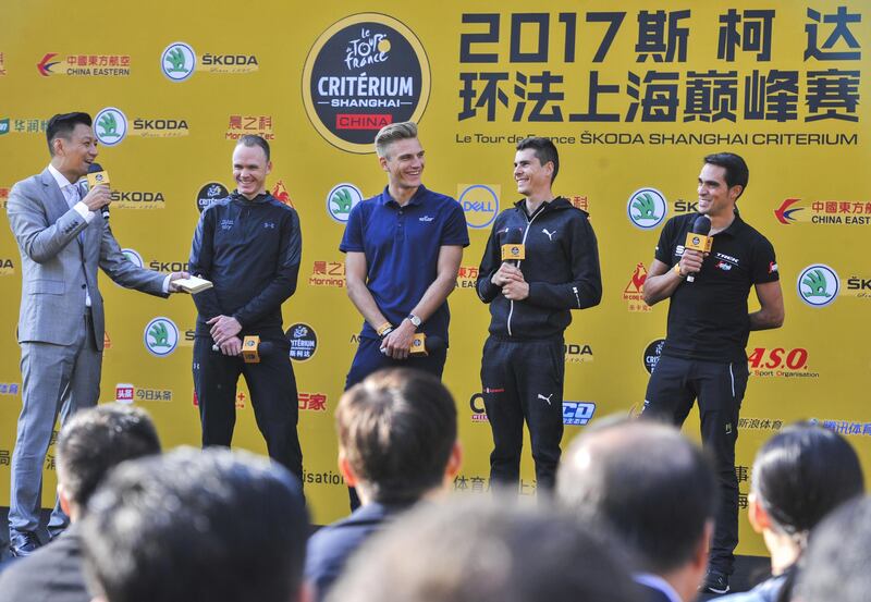 From 2nd left to right, cyclists Chris Froome of Britain, Marcel Kittel of Germany, Warren Baguil of France, and Alberto Contador of Spain speak at a pre-race launch event for Sunday’s China Criterium, in Shanghai’s financial district on October 28, 2017.
Riders will compete on October 29 in the first-ever China Criterium, part of the Tour de France’s efforts to further popularise the historic French race in Asia. / AFP PHOTO / STR / China OUT