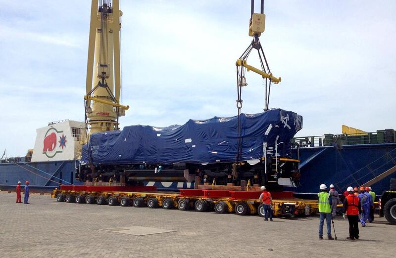 The first two of seven locomotives to be used for Etihad Rail are being unloaded at Mussafah Port in April last year. Wam