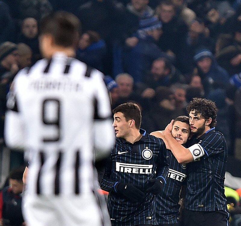 Inter Milan's Mauro Icardi, centre, celebrates with his teammates after scoring the equaliser in a 1-1 draw with Juventus in Serie A on Tuesday. Alessandro Di Marco / EPA / January 6, 2015 