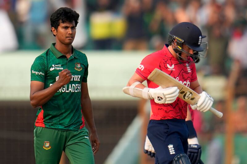 Bangladesh bowler Hasan Mahmud, left, celebrates the dismissal of England's Sam Curran for six. AP