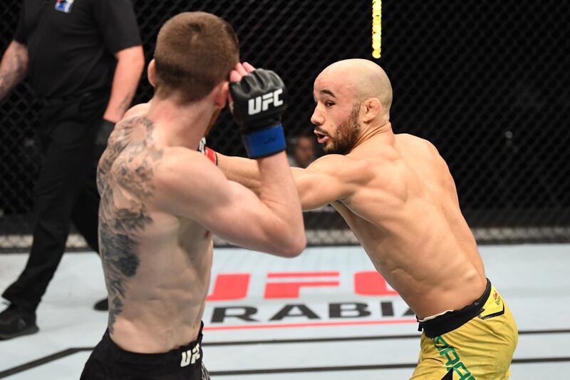Marlon Moraes (R) of Brazil punches Cory Sandhagen in their bantamweight bout during the UFC Fight Night event inside Flash Forum on UFC Fight Island in Abu Dhabi, United Arab Emirates. Josh Hedges/Zuffa LLC via Getty Images