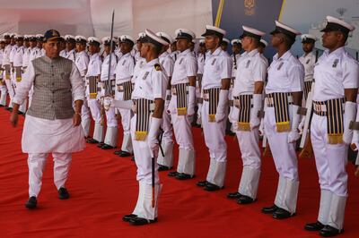 Indian Defence Minister Rajnath Singh reviews the guard of honour during the commissioning of the INS Imphal stealth-guided missile destroyer at the Naval Dockyard in Mumbai. EPA