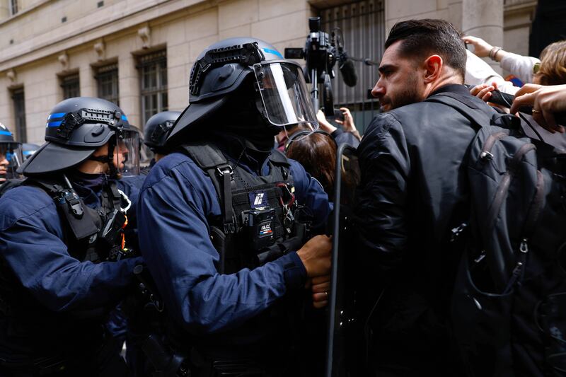 Pro-Palestinian demonstrators face French police at the Sorbonne. EPA