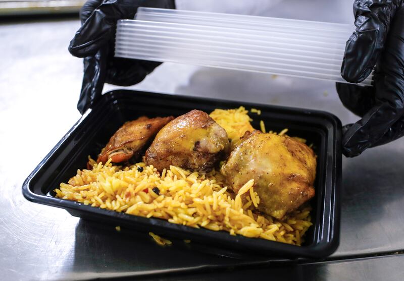 A box of rice and chicken. 