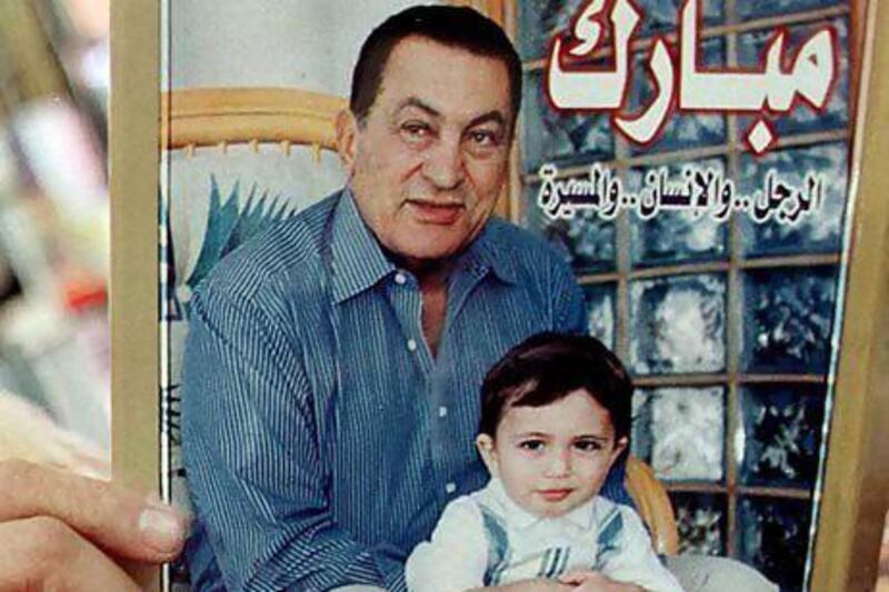 A book on Egyptian president Hosni Mubarak's life showing him with his late grandson, Mohammed Alaa Mubarak, on sale at one of Cairo's bookshops.
