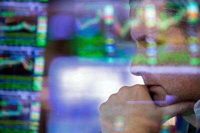 A trader at the New York Stock Exchange. Stocks are wavering between gains and losses on Wall Street as uncertainty about the war in Ukraine and inflation continues. AP