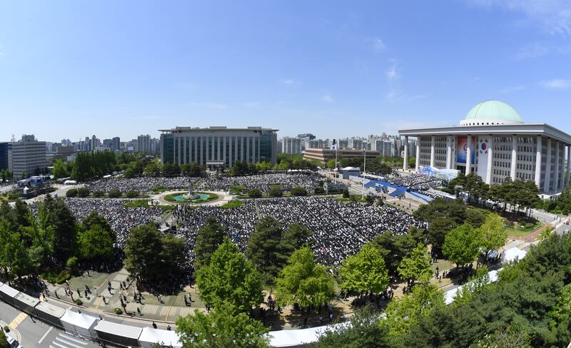 People attend the inauguration ceremony for South Korea's new President Yoon Suk Yeol at the National Assembly in Seoul. President Yoon Suk-yeol took the oath of office on Tuesday, vowing to rebuild the nation on the foundation of a liberal democracy and market economy. Getty Images