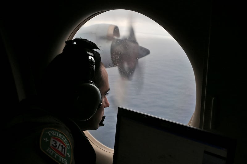 Flight officer Rayan Gharazeddine scans the water in the southern Indian Ocean off Australia on March 22, 2014. AP
