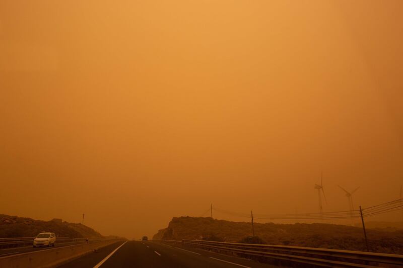 Cars drive on the TF-1 highway during a sandstorm in Santa Cruz de Tenerife, on the Canary Island of Tenerife. AFP