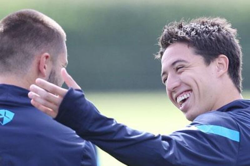 Arsene Wenger has no hesitation about playing Samir Nasri, right, who has expressed a desire to leave Arsenal.