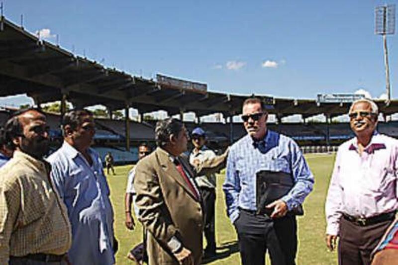 The England cricket team's security consultant Reg Dickason, second from right, examines facilities at Chennai as the BCCI secretary N Srinivasan, third from left wearing coat, looks on during a process to determine if it is safe for England to play two Test matches in India after last week's terrorist attacks in Mumbai.