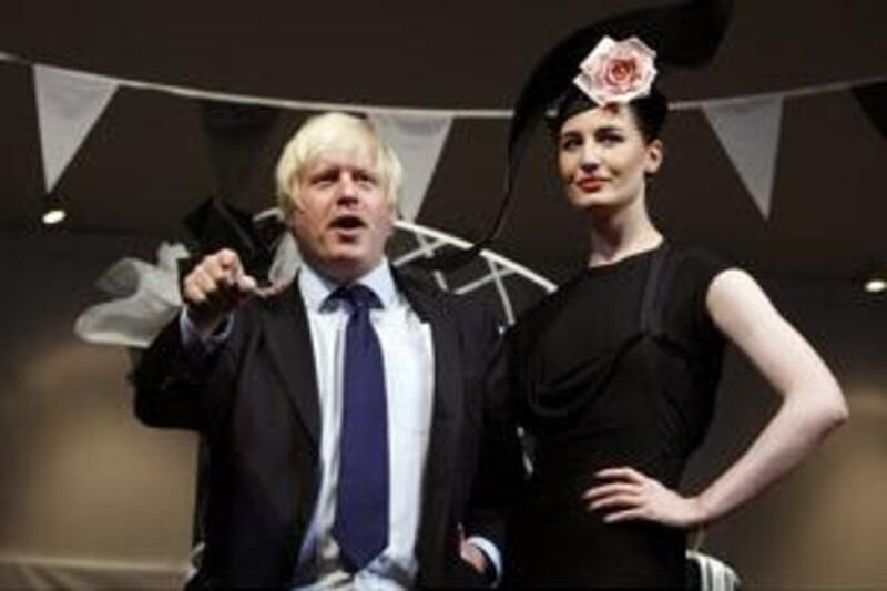 Mayor Boris Johnson officially opens London Fashion Week with the model Erin O'Connor on Friday.