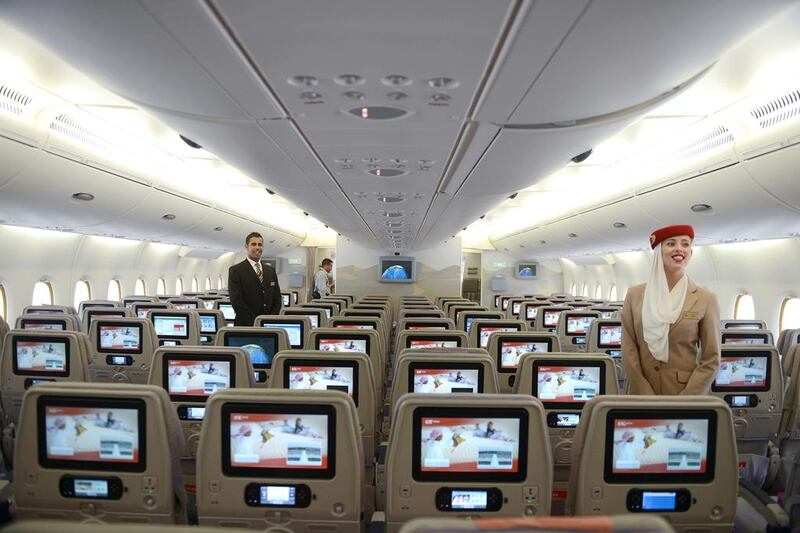 Cabin crew show the economy class cabin of an Emirates Airbus A380 at the India Aviation 2014 airshow. In January, Indian aviation authorities agreed to allow Emirates and flydubai 11,000 extra seats a year. Noah Seelam / AFP