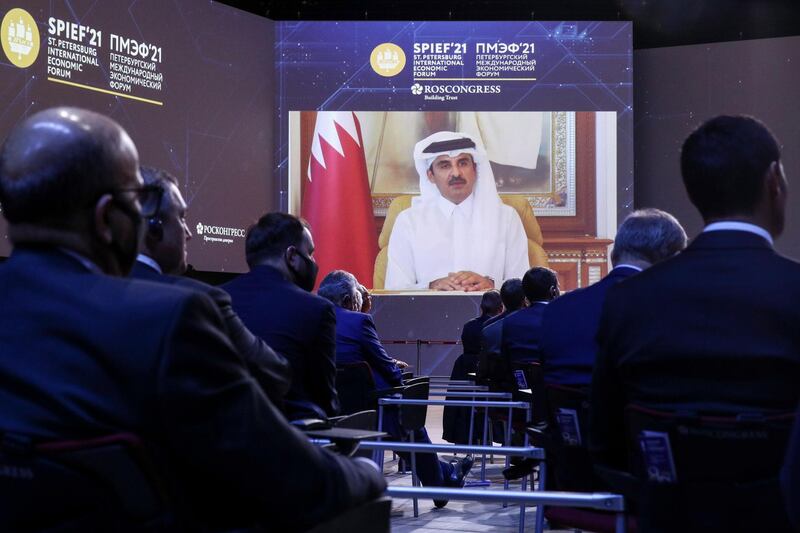 Qatar's Emir Sheikh Tamim bin Hamad Al Thani appears via video link at the St. Petersburg International Economic Forum in St. Petersburg, Russia, Friday, June 4, 2021. Russian President Vladimir Putin on Friday praised his country's response to the COVID-19 pandemic and called for a stronger global response to global warming as he sought to bolster Russia's international standing. (TASS Host Photo Agency Pool via AP)