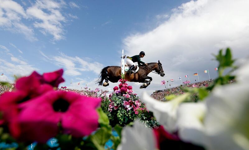 Rodrigo Pessoa, of Brazil, rides his horse Rebozo, during the equestrian show jumping competition at the 2012 Summer Olympics, Monday, Aug. 6, 2012, in London. (AP Photo/David Goldman)