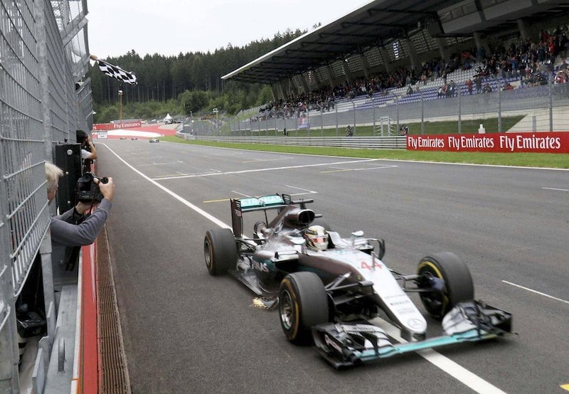 Mercedes Formula One driver Lewis Hamilton of Britain crosses the finish line to win the Formula One Austrian Grand Prix. Ronald Zak / Pool / Reuters